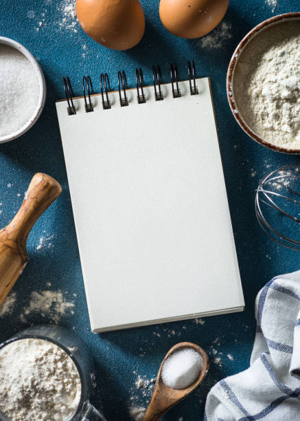 istock Baking background with cooking book and ingredients. 1650664409