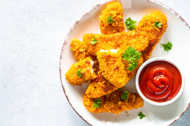 istock Chicken nuggets with ketchup sauce. 1650672669