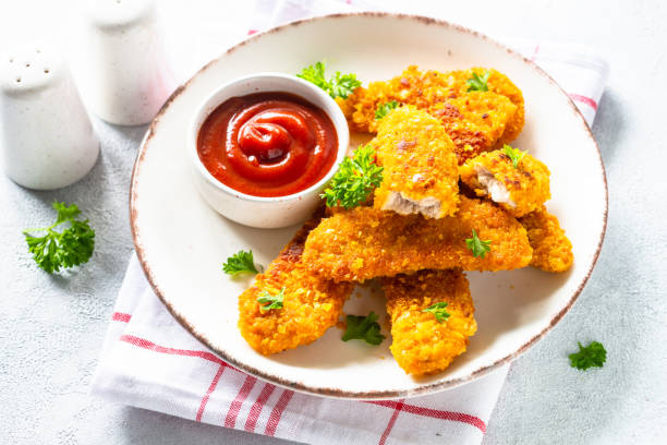 istock Chicken nuggets with ketchup sauce. 1650673190