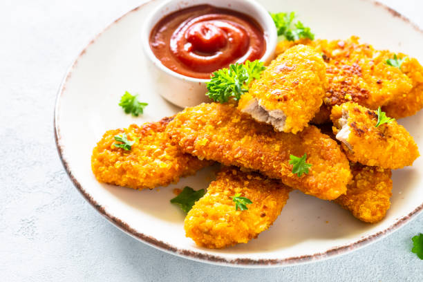istock Chicken nuggets with ketchup sauce. 1650673200