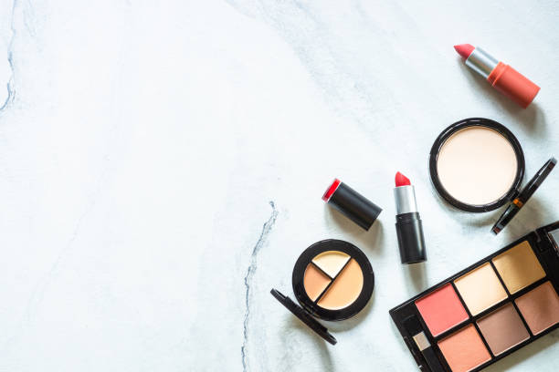istock Makeup professional cosmetics on white marble background. 1650674957