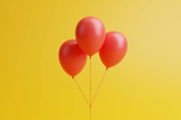 istock A bunch of red balloons on a yellow background 1650675385