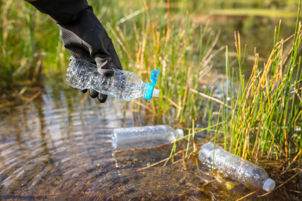 istock Environmental conservation collecting garbage and trash from water 1650675679
