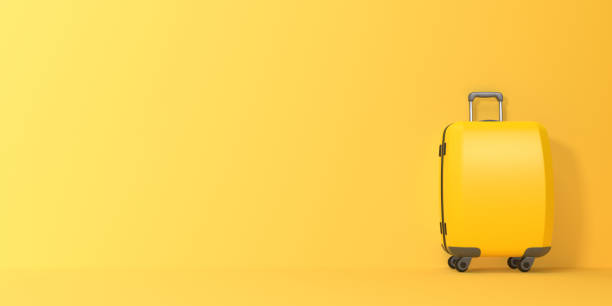 istock Travel suitcase on a yellow background with copy space 1650676281