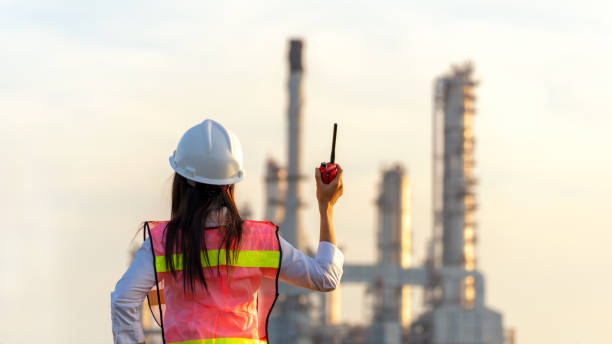 istock Engineer inspector construction building power plant energy industry in project site.  Woman worker holding white helmet for security control refinery plant.   Industry and Engineer Concept 1650678301