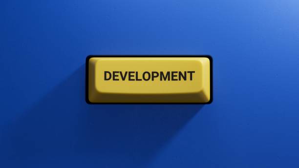 istock development.3D illustration of button of keyboard of a modern computer.Light yellow button.3D rendering on blue background. 1650678967