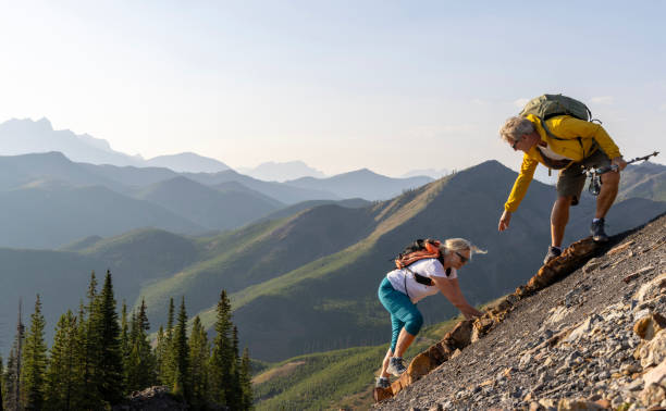 istock Senior couple explore mountain slope 1650682694
