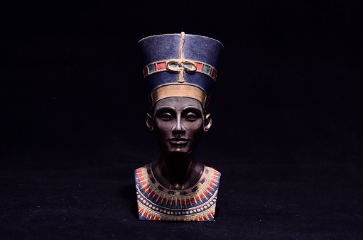 Famous Statuette Bust of Queen Nefertiti Isolated on Black Background