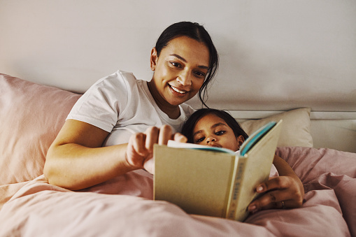 Mother and her daughter share a magical moment before bed time