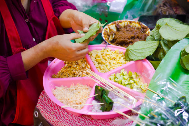 istock Thai market vendor is preparing spicy thai appetizer 1650703548