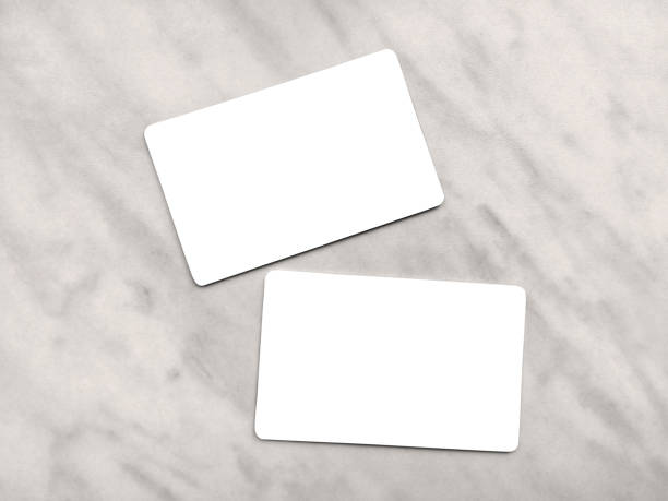 Double-sided business card template with rounded edges on a gray marble background