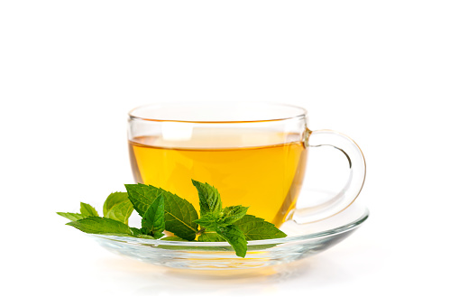 Soothing herbal tea blend with mint. Isolated on white background