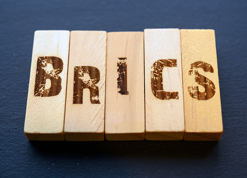 Wooden blocks arranged in the abbreviation BRICS an international alliance of countries, Brazil, Russia, India, China and South Africa