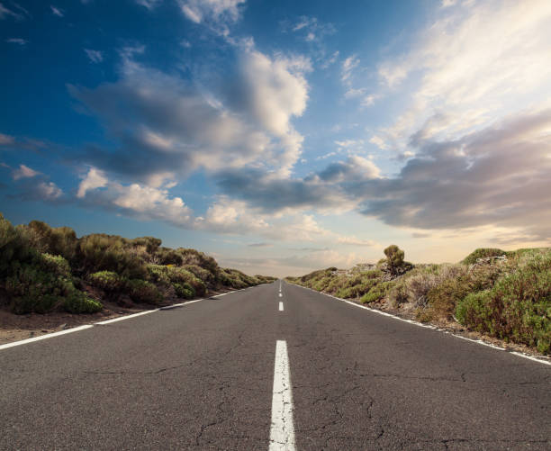 istock Rural road, mountain and blue sky clouds background 1650751282