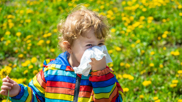 istock The child is allergic to flowers. Selective focus. 1650759113