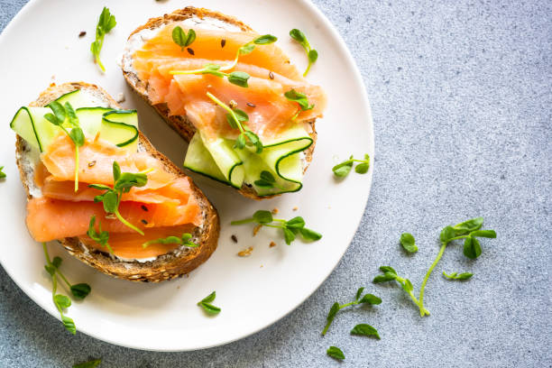 istock Open sandwich with cream cheese, salmon and cucumber. 1650759628