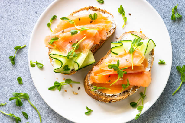 istock Open sandwich with cream cheese, salmon and cucumber. 1650759629