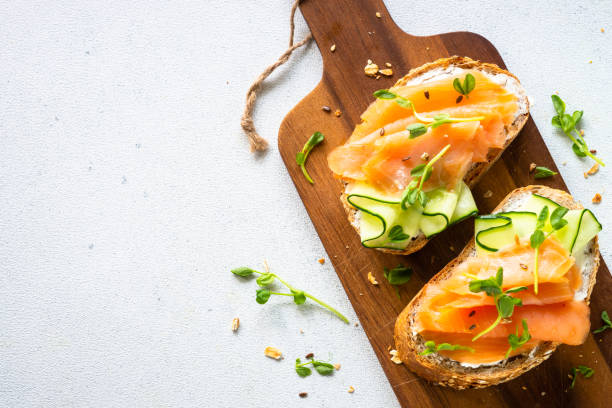 istock Open sandwich with cream cheese, salmon and cucumber. 1650759643