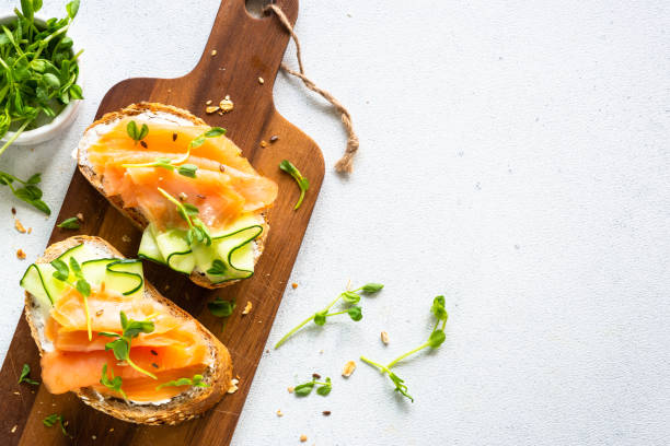 istock Open sandwich with cream cheese, salmon and cucumber. 1650759645