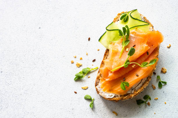 istock Open sandwich with cream cheese, salmon and cucumber. 1650759654