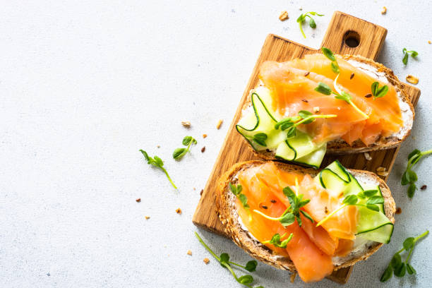 istock Open sandwich with cream cheese, salmon and cucumber. 1650759656