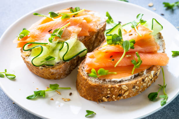 istock Open sandwich with cream cheese, salmon and cucumber. 1650763942