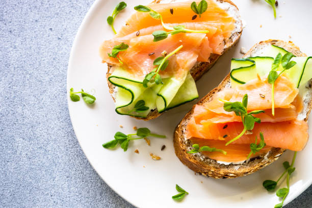 istock Open sandwich with cream cheese, salmon and cucumber. 1650768434