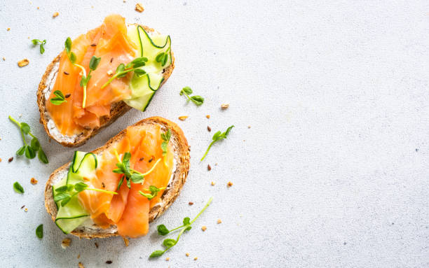 istock Open sandwich with cream cheese, salmon and cucumber. 1650768971