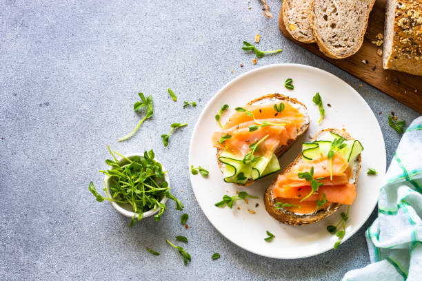 istock Open sandwich with cream cheese, salmon and cucumber. 1650770597