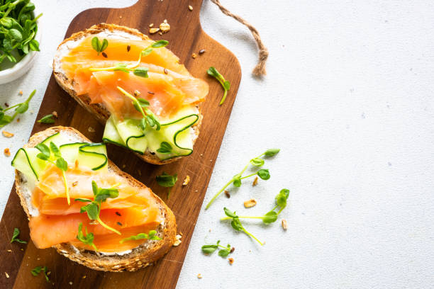 istock Open sandwich with cream cheese, salmon and cucumber. 1650772822