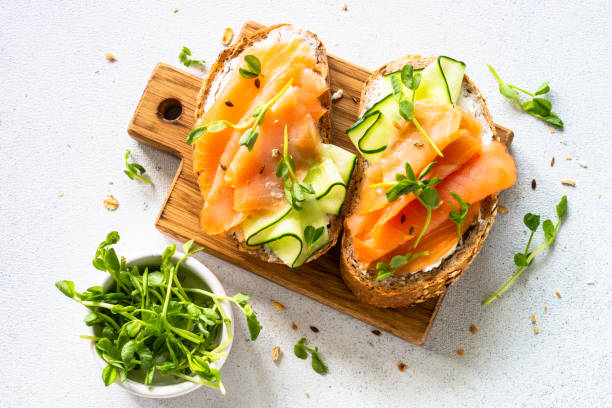 istock Open sandwich with cream cheese, salmon and cucumber. 1650772823