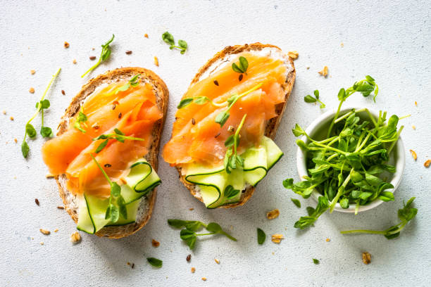 istock Open sandwich with cream cheese, salmon and cucumber. 1650776064