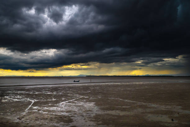 istock Storm Clouds Over Cold Sea Water. Stylized panoramic seascape. Dramatic sky over sea 1650801771