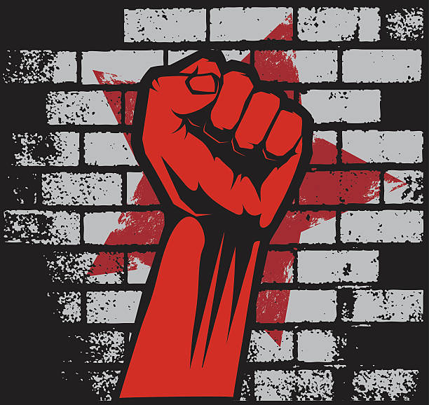 istock Anarchic style image of red fist against brick backdrop 165080672