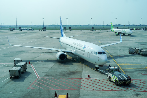 New Delhi, India, July 29, 2018 : Airplane standing at Dabolim Airport, Goa, India. Dabolim Airport is the sole International Airport in Goa. It is operated by the Airports Authority of India as a Civil Enclave in a Military Airbase named INS Hansa.