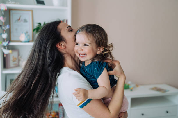 istock Affectionate mother and daughter embracing at home. 1650830235