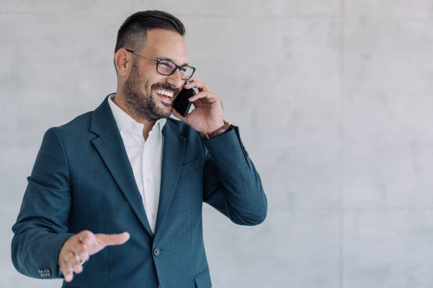 Businessman talking on the phone in the office.