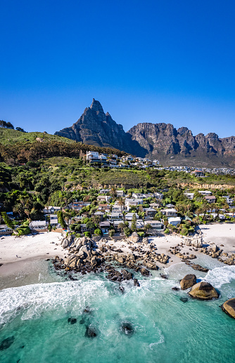 Beach and Twelve Apostles mountain in Camps Bay near Cape Town in South Africa.