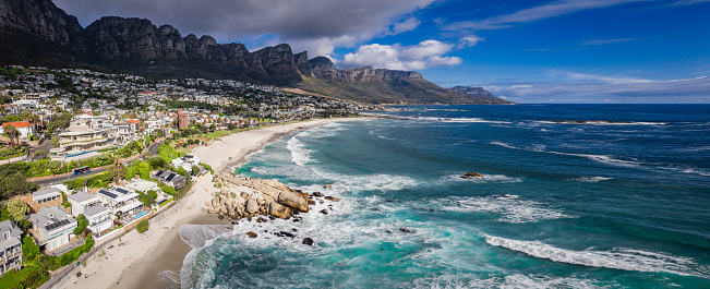 Landscape view of Cape Town Suburb, Camps Bay, on the Atlantic coast with Twelve Apostle mountains in the background