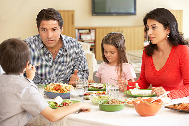 istock Young Hispanic Family Arguing While Having Meal 165084428