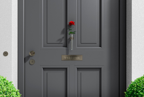 metaphorical welcome image showing a classical door with welcome sign and a red rose - rendering