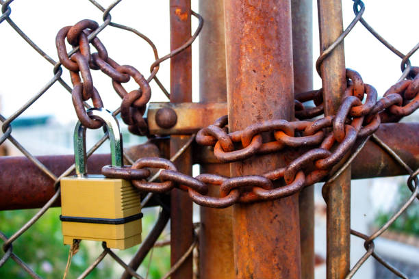 istock Locked Door by Brass Padlock and Big Chain 1650849959
