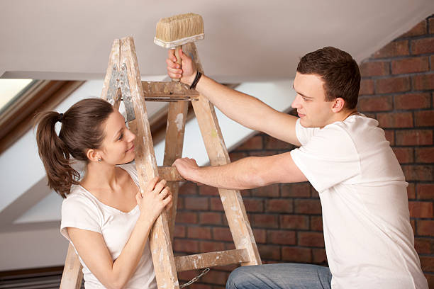istock Couple painting a room 165085319