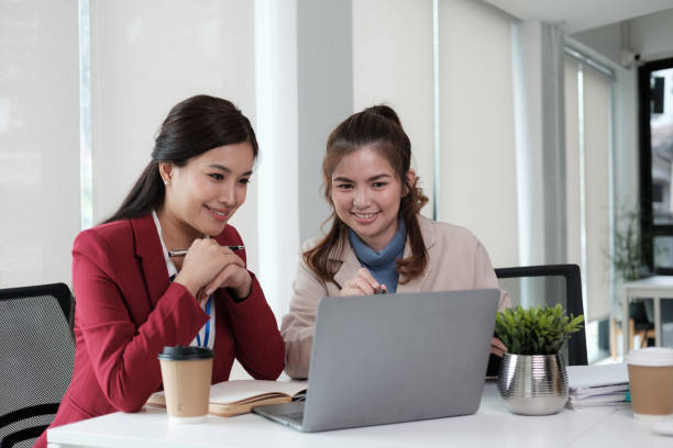 istock Smart business people working together with laptop while talking in the co working place. 1650855310