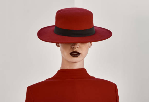 istock Beauty, style and classy model in a studio with a glamour, face and makeup routine. Stylish, classy and female person with fancy hat for accessory with elegant fashion isolated by white background. 1650856020