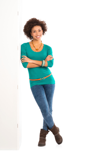 Happy Young Woman Isolated Leaning Against a Panel On White Background