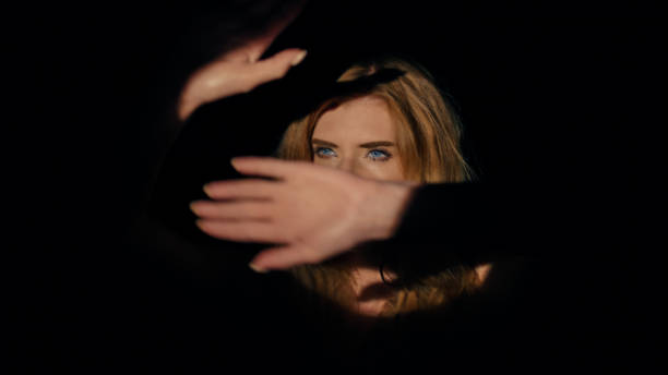 istock A red-haired actress in round,  theatrical light. 1650859058
