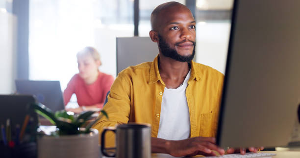 istock Office, computer and laptop of businessman with information technology, company software or website management for innovation. Desktop, multimedia technology of IT black man working on digital update 1650859285