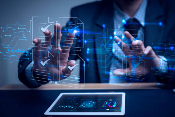 istock Businessman writes signing contract, designs, draws, or sketches projects through a tablet on the office desk. Hand concept stamp of approval on a public notarization certificate document electronic. 1650864512