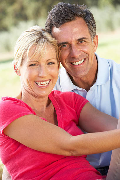 istock Middle Aged Couple Relaxing In Countryside 165086588